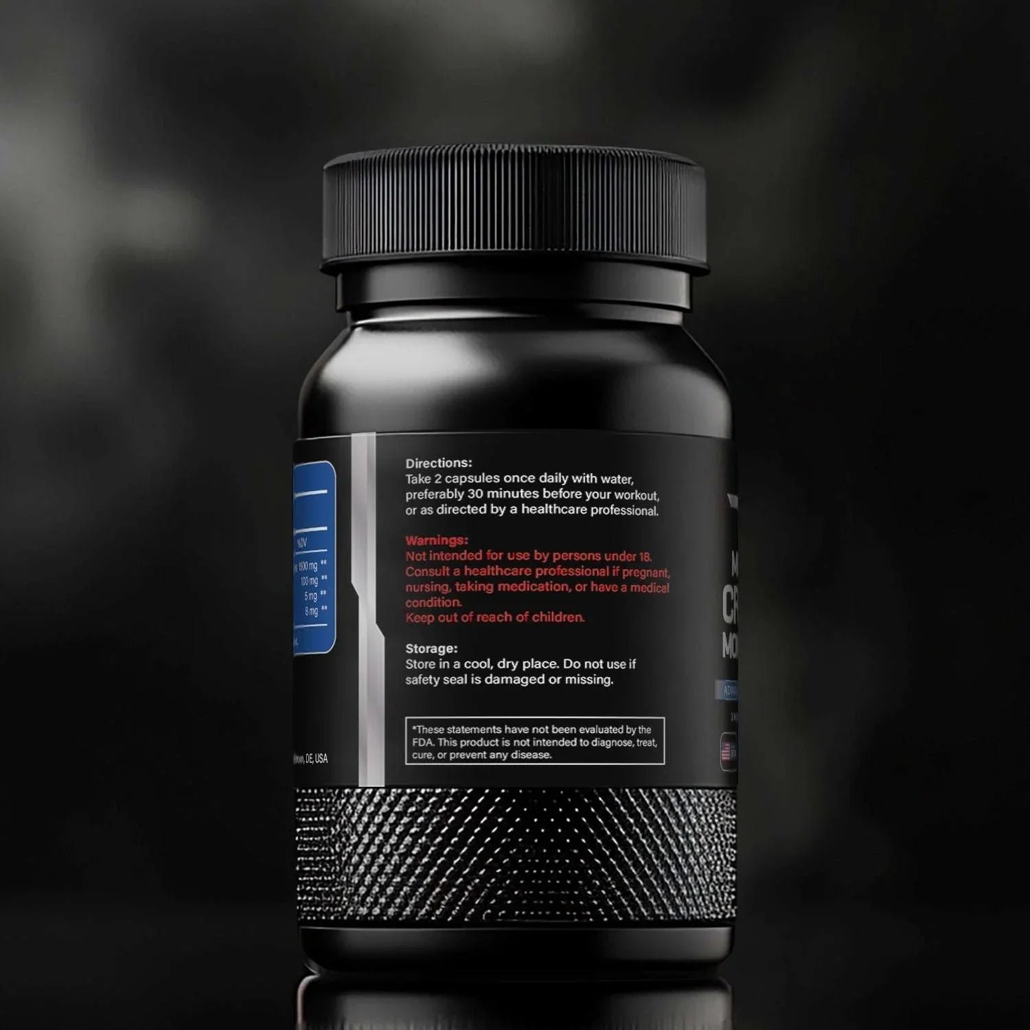 Black creatine monohydrate supplement bottle with dosage and warning text, on dark background.