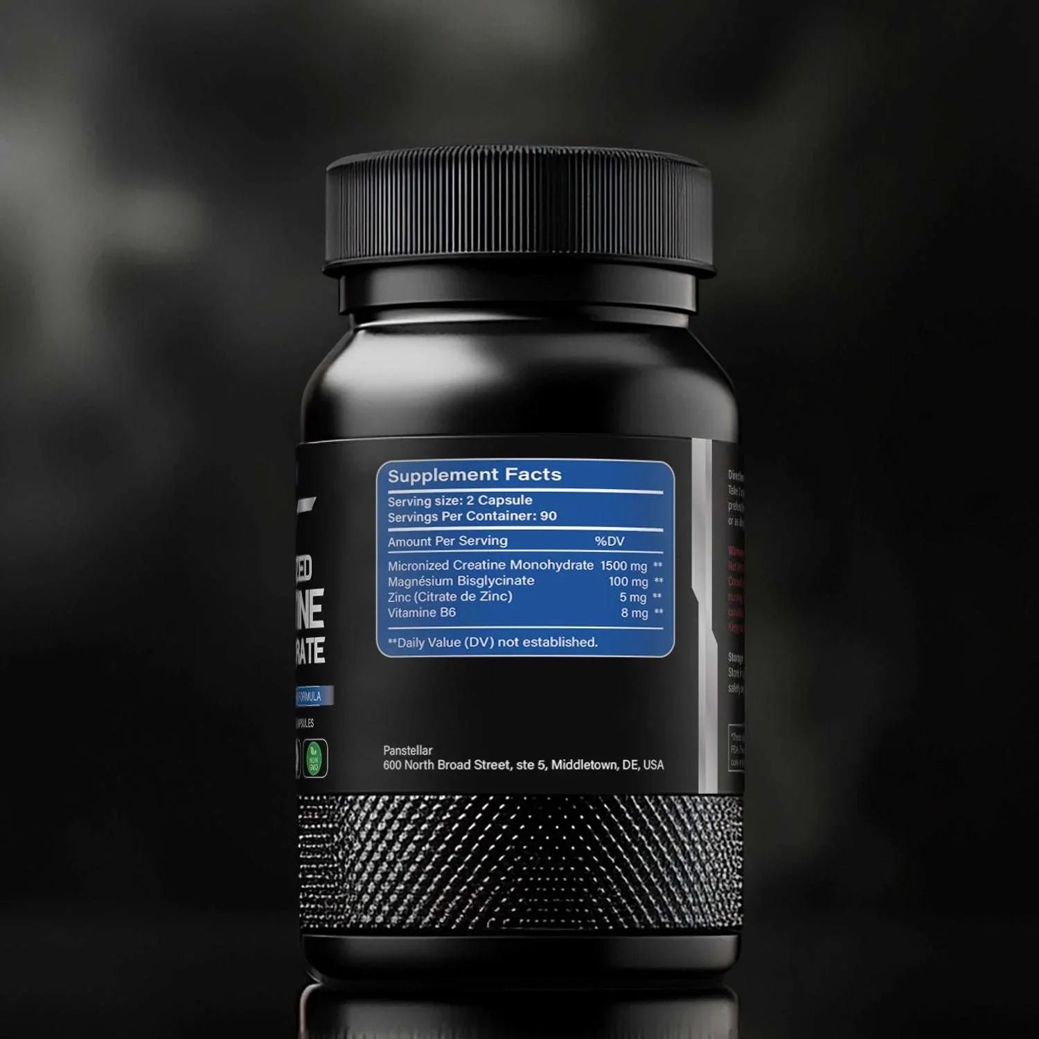 Black bottle of creatine monohydrate supplement with visible supplement facts label